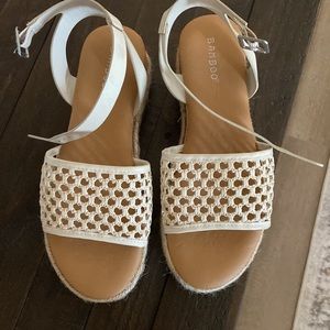 Women’s bamboo wedge heels size 7 in NEW condition. Only worn a few times!